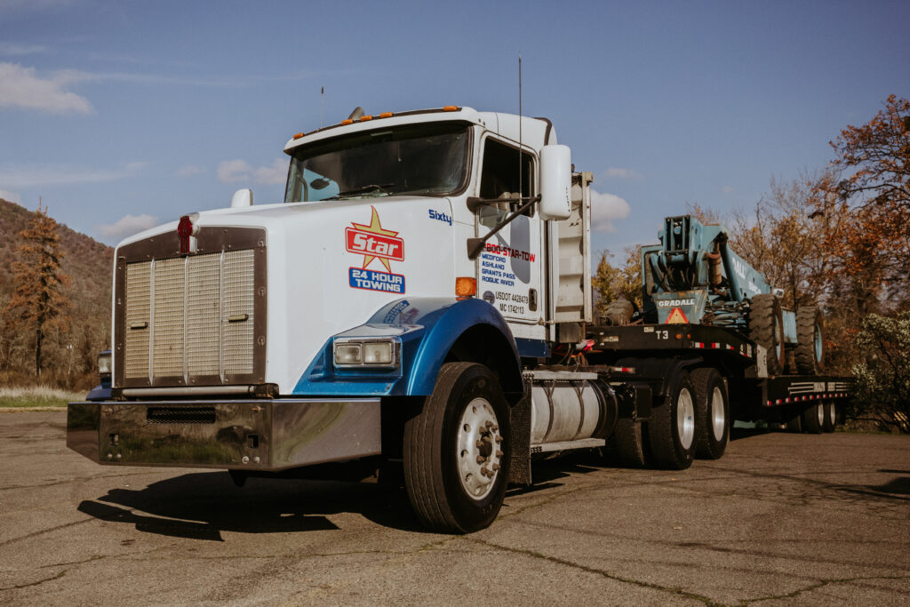 Star 24 Hour Towing heavy-duty truck hauling equipment in Southern Oregon