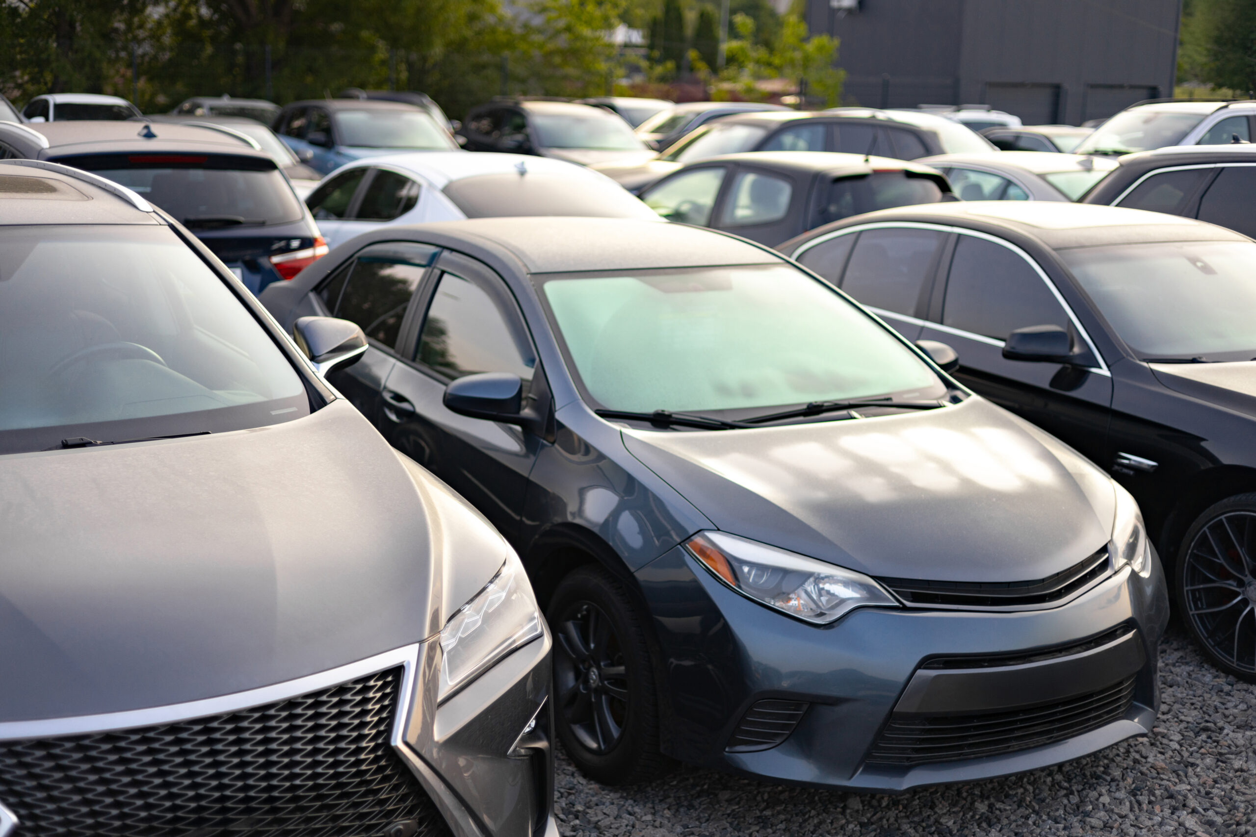 A row of cars parked outdoors,